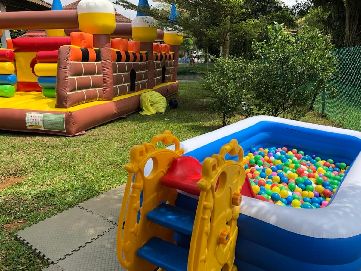 Bouncy castle and ball pit combo at a backyard event