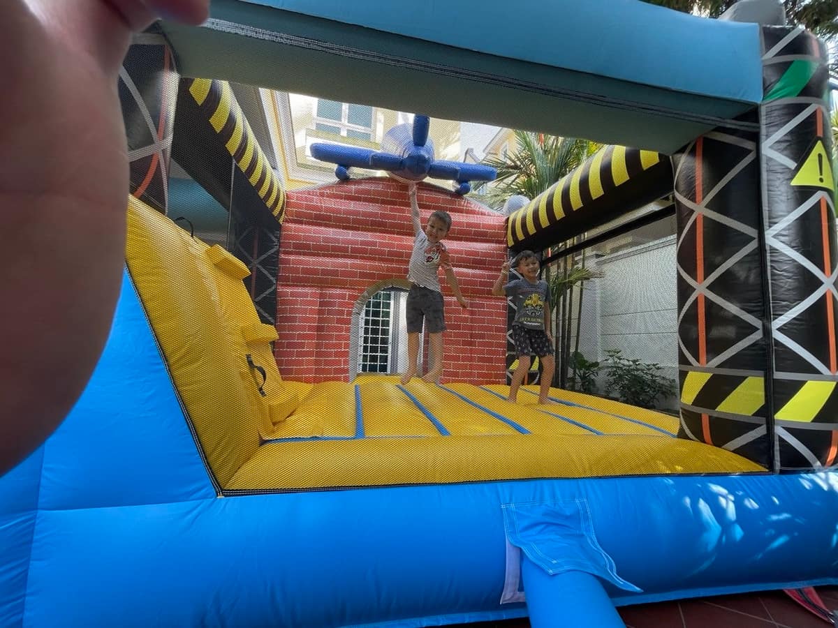 Kid mid-jump on a traffic light obstacle course