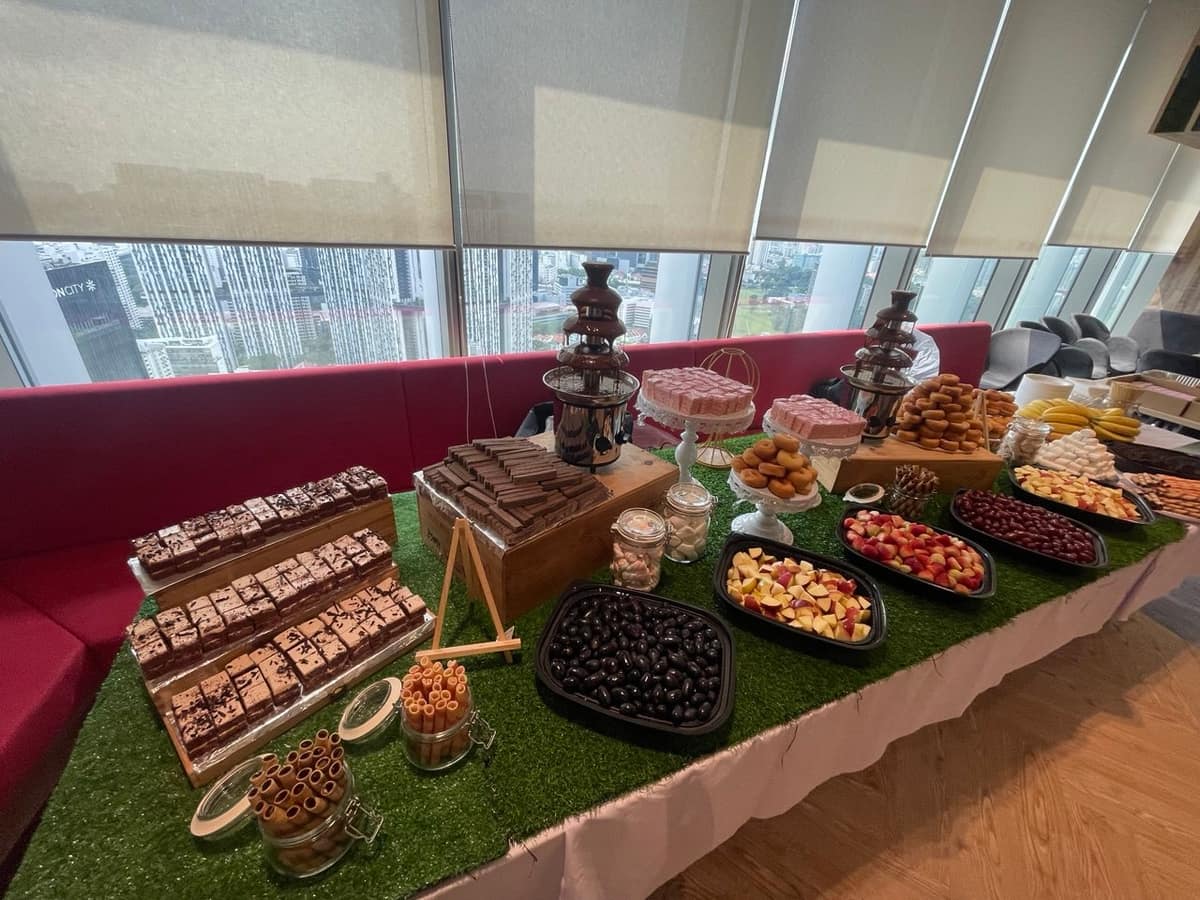 Styled dessert and live food station spread by BounceParkSG