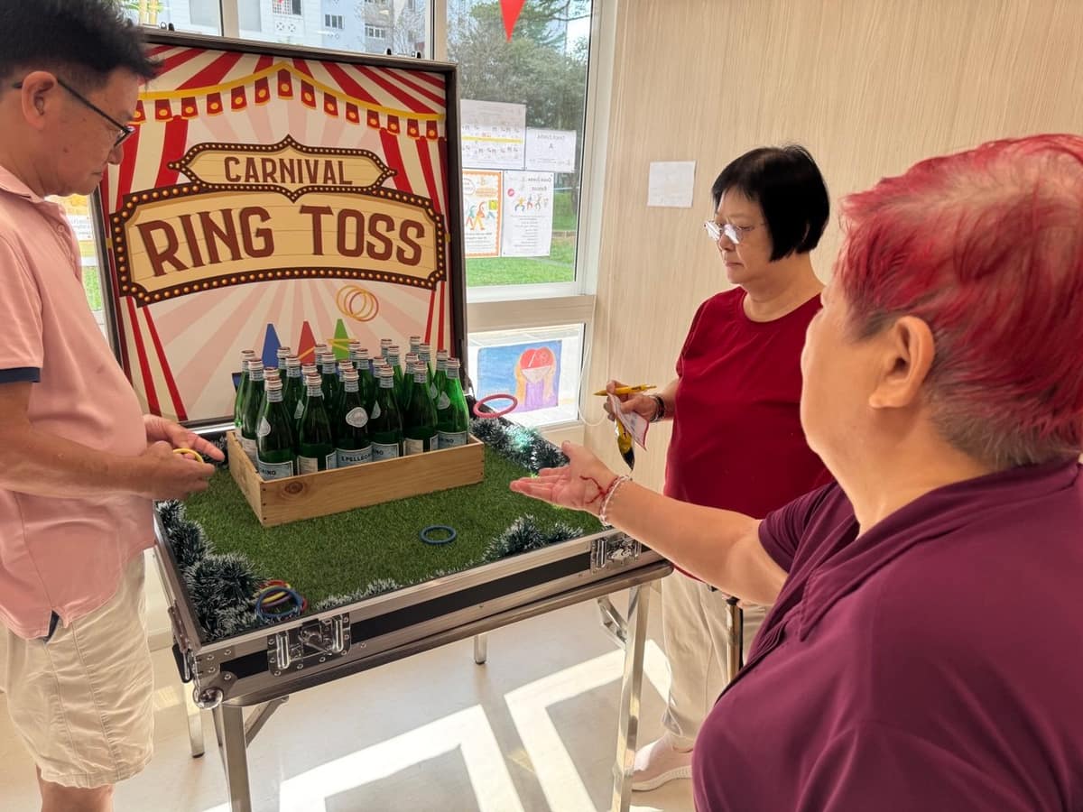 Couple playing ring toss at a BounceParkSG event