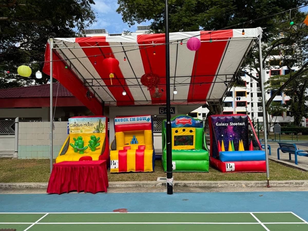 Multi-station carnival tent set up on a tennis court