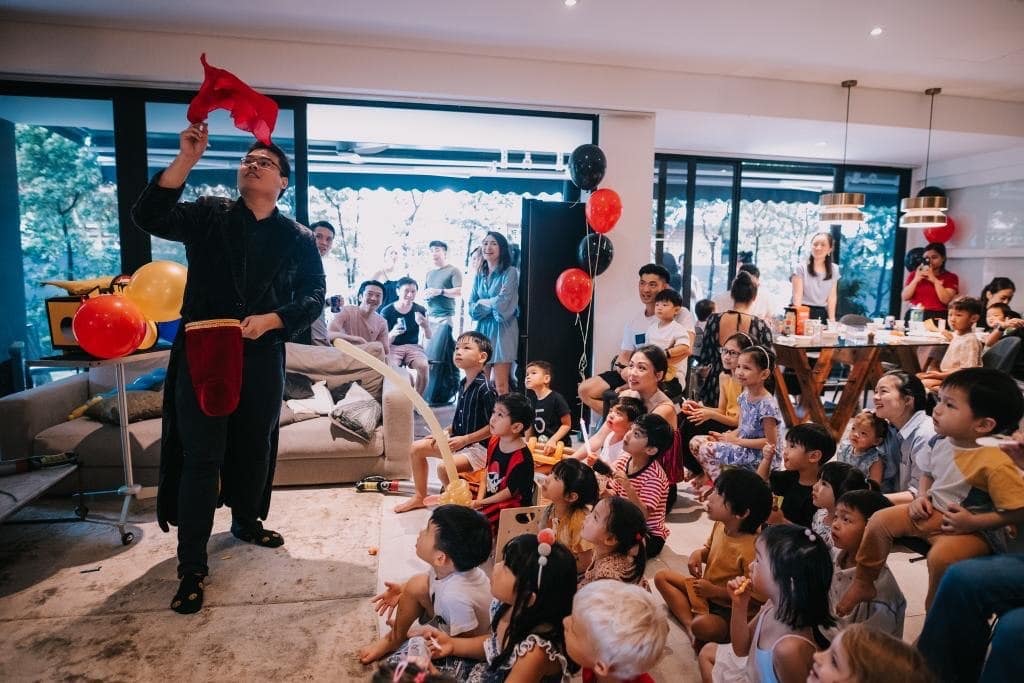 Magician performing for a family audience