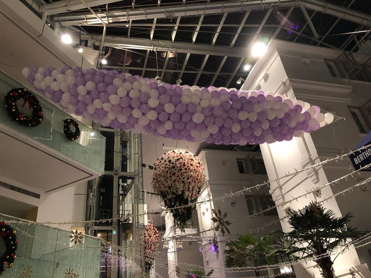 Balloon drop net rigged in a mall atrium by BounceParkSG