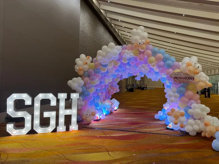Balloon arch and letters at an SGH event