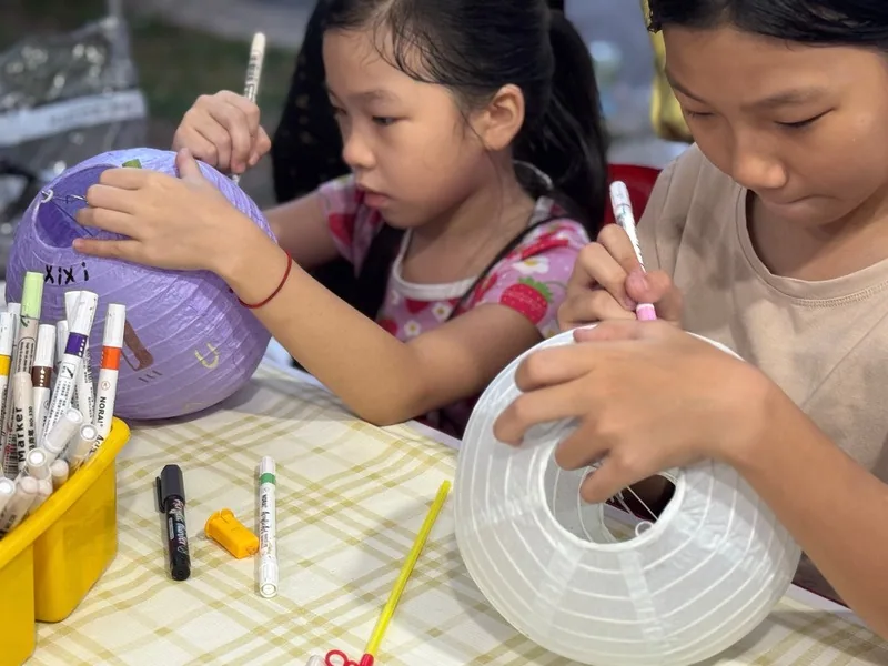 Children painting lanterns