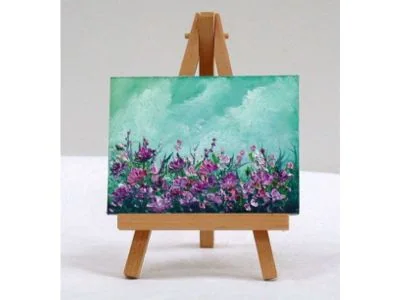 A painted mini canvas on an easel