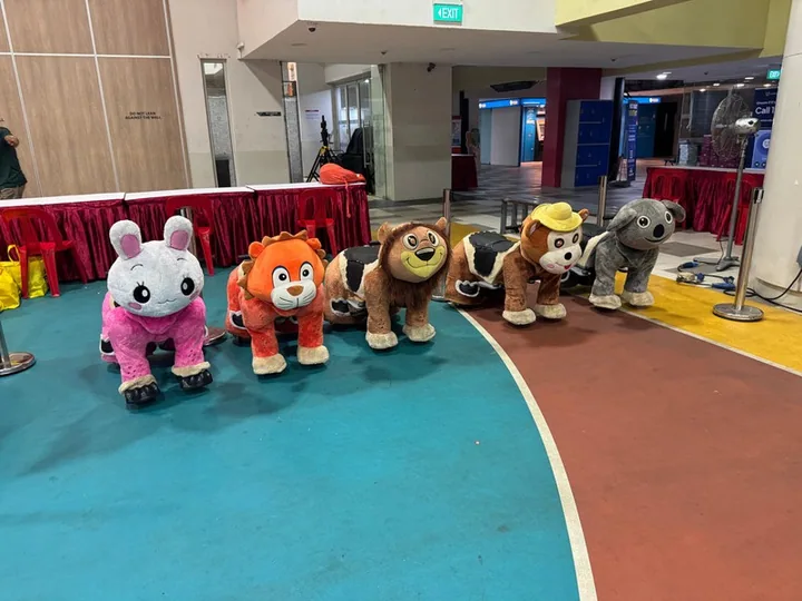 A row of electronic animal rides ready for guests