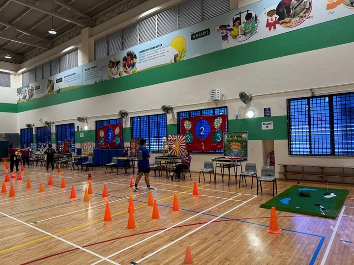 Carnival games laid out across a school hall by BounceParkSG