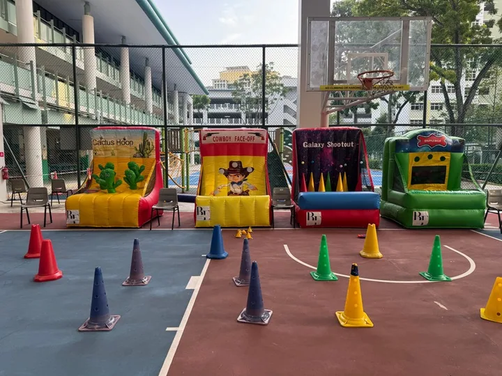 Carnival game booths on a school court