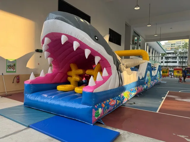Shark themed inflatable slide indoors