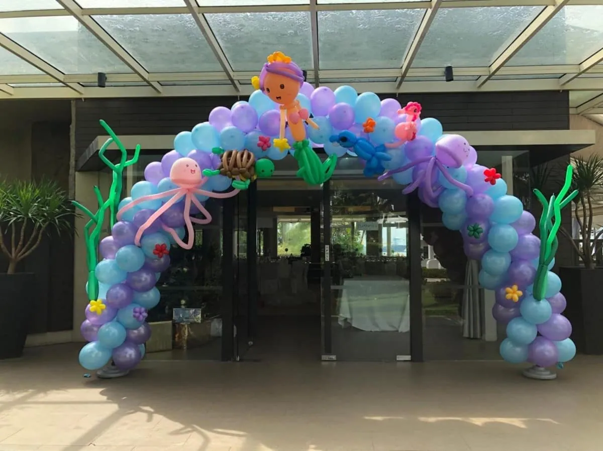 Pastel balloon arch at an event entrance